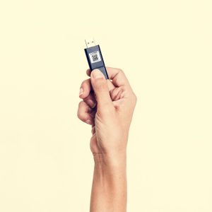 Hand holding data storage handy drive isolated on white